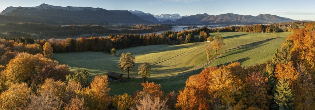 Aerial view of a mountain landscape in autumn, trees, morning light, panorama, view of Zugspitze and Bavarian Alps, Alpine foothills, Bavaria, Germany
