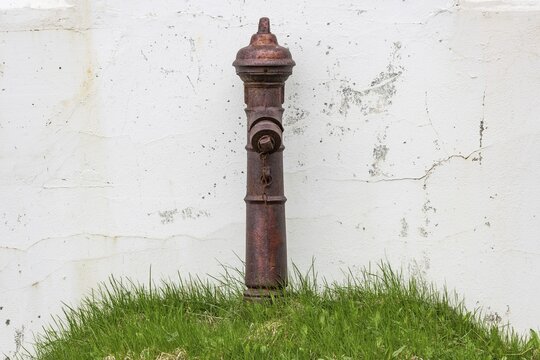 Hydrant on grassy hill, Dj&uacute;pav&iacute;k, Reykjarfj&ouml;r&eth;ur, Strandir, &Aacute;rnes, Westfjords, Iceland