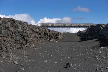 Bridge between the continents crosses the rift valley between the American and European continental plates, Reykjanes Peninsula, Iceland