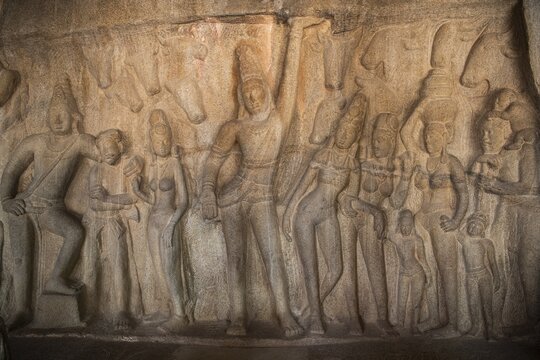 Shepherd god Krishna performs miracles and raises Mount GovardhanKrishna raises Mount Godhavaran, bas-relief, detail, UNESCO World Heritage Site, Mahabalipuram or Mamallapuram, Tamil Nadu, India