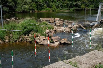 Canoe Kayak Slalom. Green and red gates. Fast-flowing river with slalom gates. Bad Kreuznach, Germany.