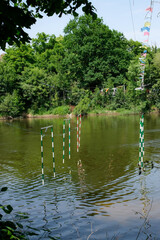 Canoe Kayak Slalom. Green and red gates. River with slalom gates. Bad Kreuznach, Germany.