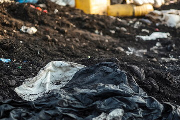 Plastic waste polluting soil highlighting environmental pollution land contamination and human impact on nature