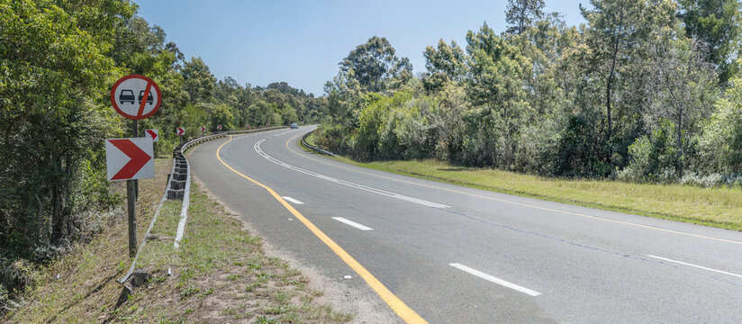 Garden Route road bends in green countryside, near Bitou, South Africa