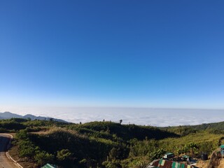 Peaceful mountain nature landscape at sunrise with clouds