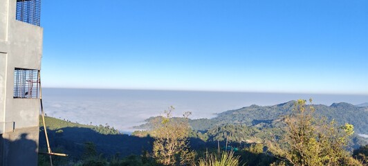 Mountain landscape with clouds and mist, scenic nature view