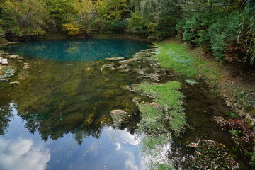 Waterfall on the river with reflection in water