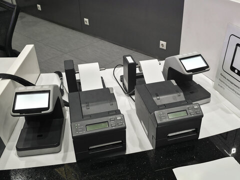 Airport ticket printing machines - Powered by Adobe