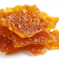 Sesame honey brittle macro, golden bubbles, jagged edges detailed