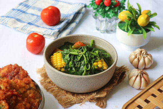 Sayur bayam, also known as sayur bening, is a light Indonesian vegetable soup made with tender Chinese green amaranth, sweet corn, and fresh tomatoes.