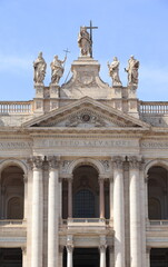 Obraz premium Saint John Lateran Basilica Exterior Detail with Pediment and Columns in Rome, Italy