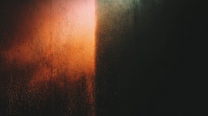 Textured surface lit with gradient colors, creating a dramatic split of orange and darkness