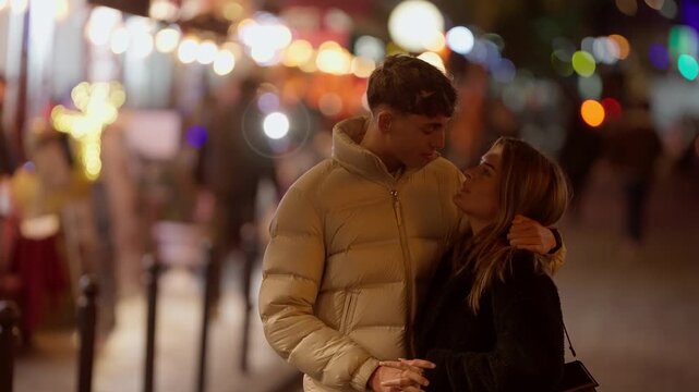 A romantic couple shares a kiss in Paris France at night The city lights create a blurred bokeh background adding to the intimate and loving moment The scene captures the essence of love and affection