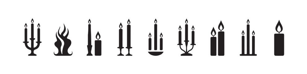 Fototapeta premium Collection of long taper candles and multi arm candelabra silhouettes perfect for religious or formal events
