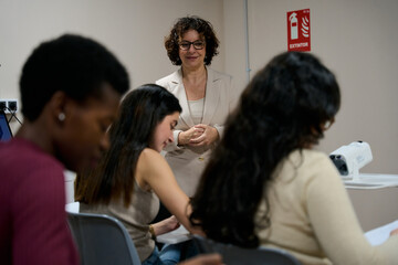 Teacher mentoring students during a classroom lesson