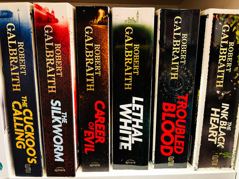 Book collection by Robert Galbraith featuring six crime thrillers on a shelf