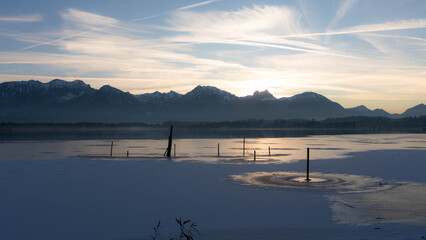 Sunset on Lake Hopfen in Bavaria Germany in Winter 2025 - Beautiful Alps with Great LIght and Ice. High quality photo