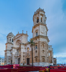Fototapeta premium Cadiz, Spain - April 16, 2025: Cadiz Cathedral during Holy Week celebrations, prepared for processions in Cadiz, Spain.