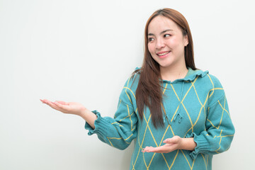 Portrait of a young happy Asian woman against white background showing copy space