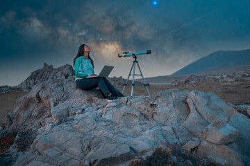 Woman studying cosmos and astronomy under a starry night sky
