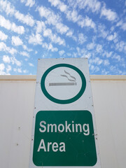 Vertical image of poster with pictogram and text 'Smoking area'. Sign isolated on white background,...