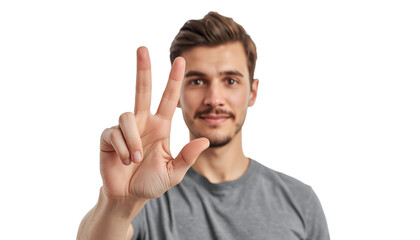 A young man making a peace sign on a