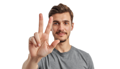 A young man making a peace sign on a