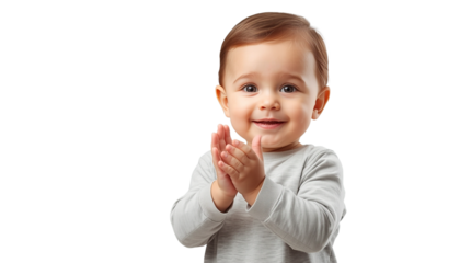 A happy baby clapping hands on
