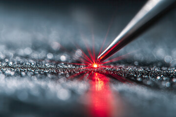 Precision laser technology emitting a focused red beam onto textured surface for high-accuracy measurement and industrial applications in a futuristic setting