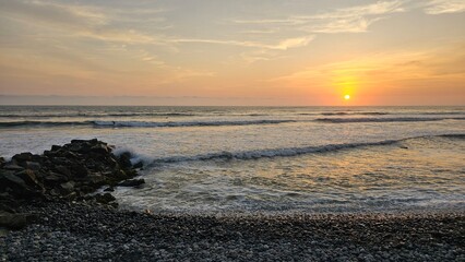 Fototapeta premium Sunset at La Pampilla beach, a known beach and surf spot in Lima, Peru.