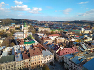city ​​panorama visible ancient European city Lviv church roofs houses streets view from above drone
