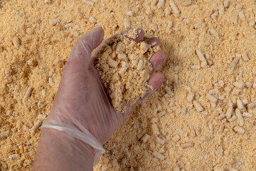 hold wood pellets from pine sawdust after getting on them with a large amount of water, some of them did not get wet and retained their cylindrical shape.