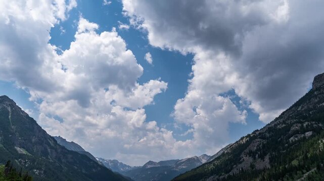Big clouds in high mountains time lapse 