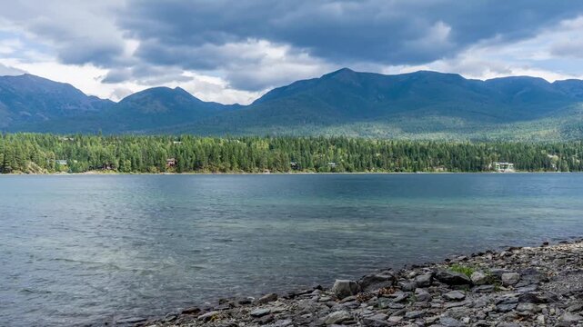 Clouds over mountain lake time lapse 