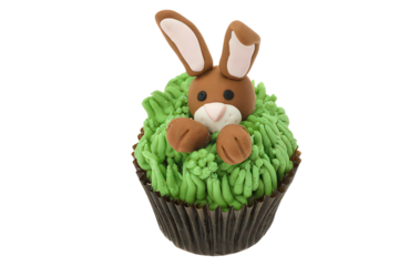 Easter bunny cupcake with green icing and chocolate brown wrapper on transparent background sweet treat festive dessert perfect for spring holiday celebrations
