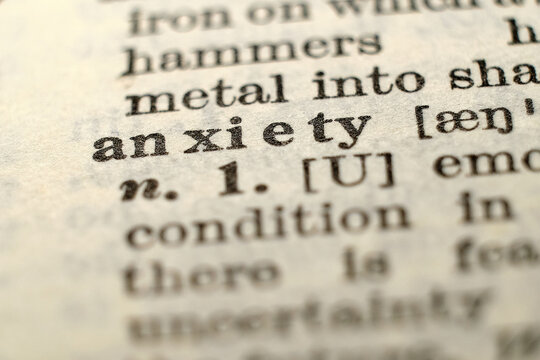 Macro dictionary page showing &ldquo;anxiety&rdquo;, concept for stress, worry, mental health and support.