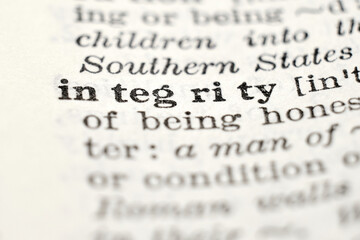 Fototapeta premium Integrity definition in vintage dictionary, macro close-up
