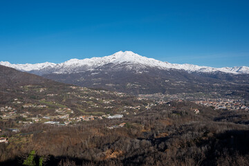 Majestic view of the snow-capped Quinzeina mountain. A serene winter landscape in the Italian Alps inspiring awe and tranquility