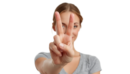 A young woman showing a peace sign with her fingers on