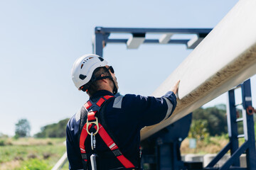 Professional wind turbine engineers preparing and inspecting equipment for installation and maintenance at a renewable energy site, teamwork, clean power, and sustainable technology.