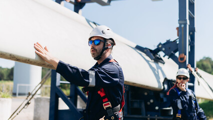 Professional wind turbine engineers preparing and inspecting equipment for installation and...