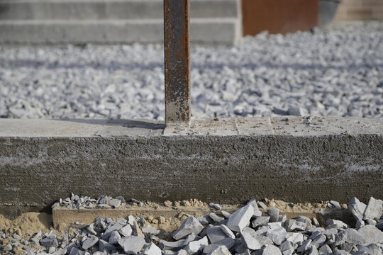 Concrete strip foundation prepared for fence installation, showing reliable base, construction process, and durable groundwork. High quality photo