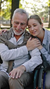 Daughter hugs senior father having deep conversations