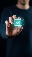 A person s hand holds a glowing teal checkmark symbol suspended in the air representing approval or completion