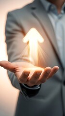 A person presenting a glowing upward arrow symbolizing growth and positive direction