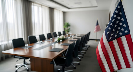 A blurry image of a conference room with american flag