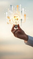 A hand holding a lightbulb with percent signs symbolizing innovative financial growth and opportunity