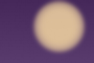 A warm, soft, blurred circle illuminates a deep purple background with a gentle glow