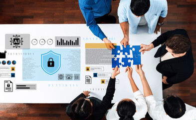 A diverse team collaborates on a data security strategy, showcasing puzzle pieces and digital graphics, emphasizing teamwork and innovative problem-solving in a modern office setting. Gantry