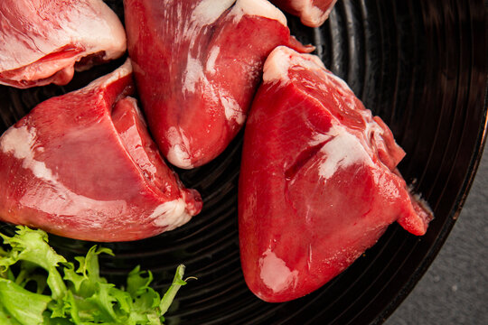Turkey heart offal meat tasty snack fresh delicious gourmet food background on the table  rustic food top view copy space
